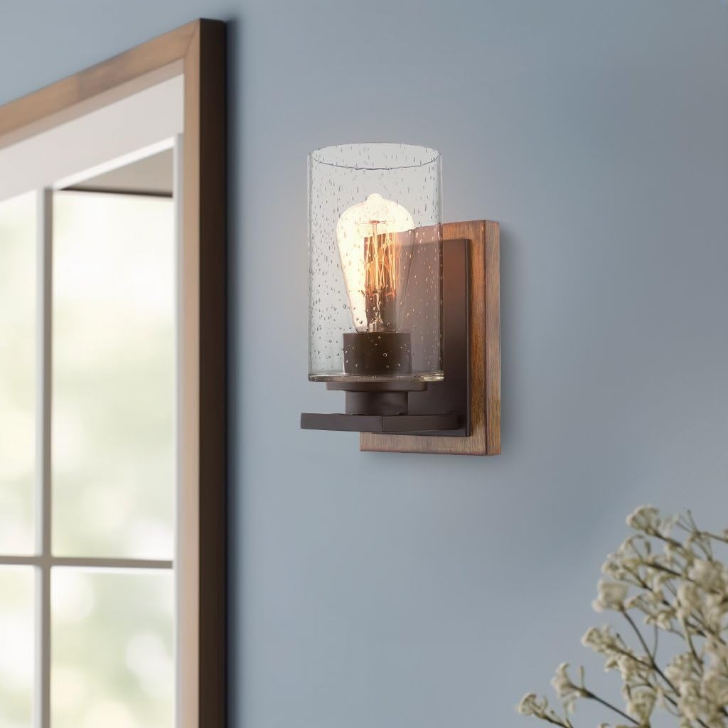 Kira Home Sedona 9" Modern Rustic Wall Sconce + Seeded Glass Cylinder Shade, Oil Rubbed Bronze + Wood Style Walnut Finish