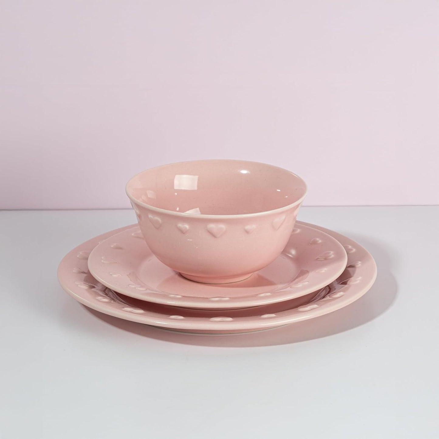 Paris Hilton 12-Piece Dinnerware Set, Embossed Hearts. Iconic Ceramic Stoneware Service for 4 with Dinner Plates, Salad Plates, and Bowls, Microwave & Dishwasher Safe, Pink