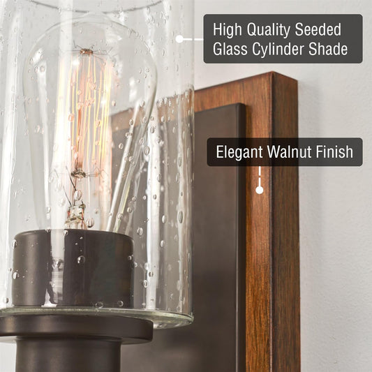Kira Home Sedona 9" Modern Rustic Wall Sconce + Seeded Glass Cylinder Shade, Oil Rubbed Bronze + Wood Style Walnut Finish