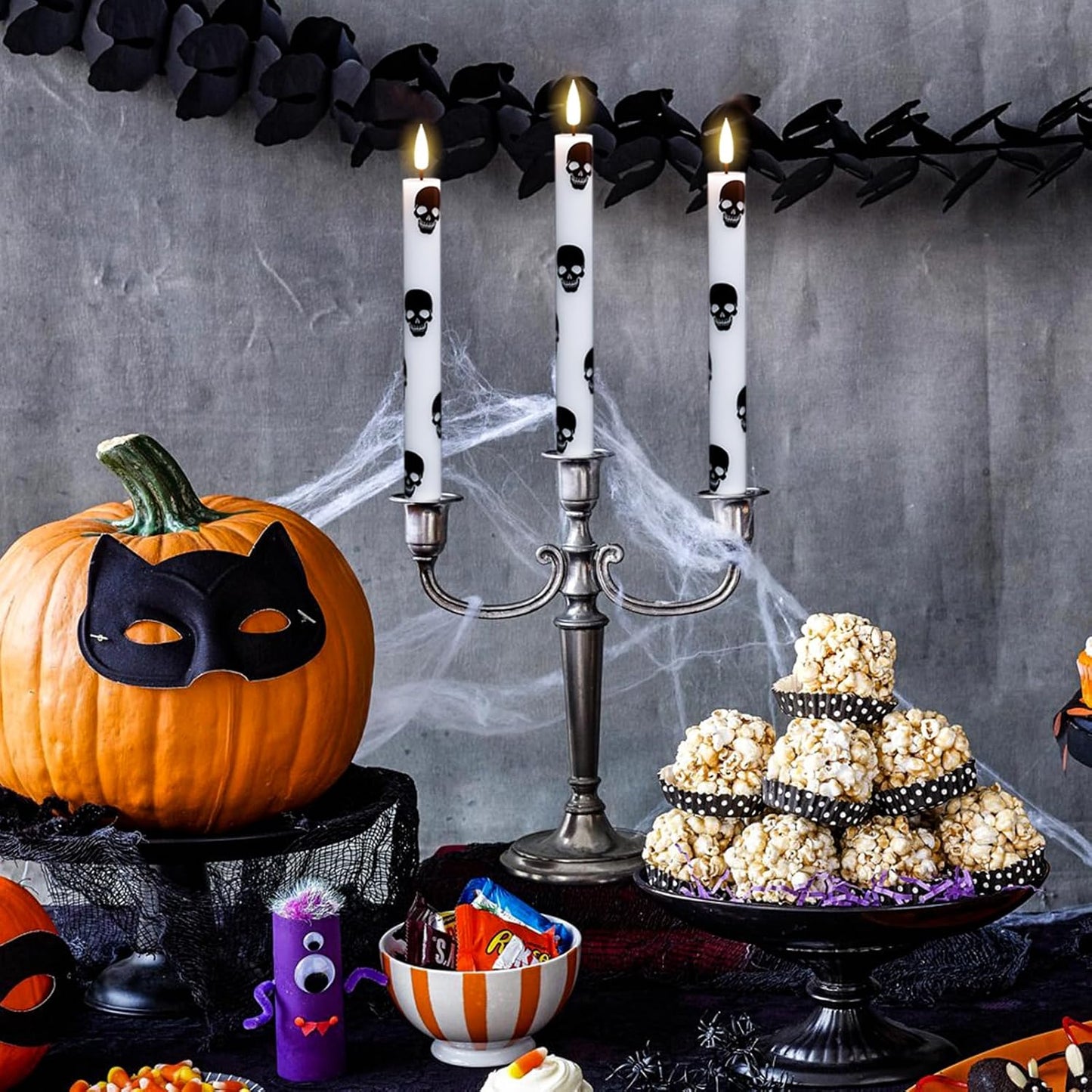 GenSwin Halloween Flameless Taper Candles Remote Timer, 4 Pack Real Wax LED Taper Candles Battery Operated Flickering with Skull Prints, Flameless Candlesticks for Halloween Decor(0.75”x 9.65”)