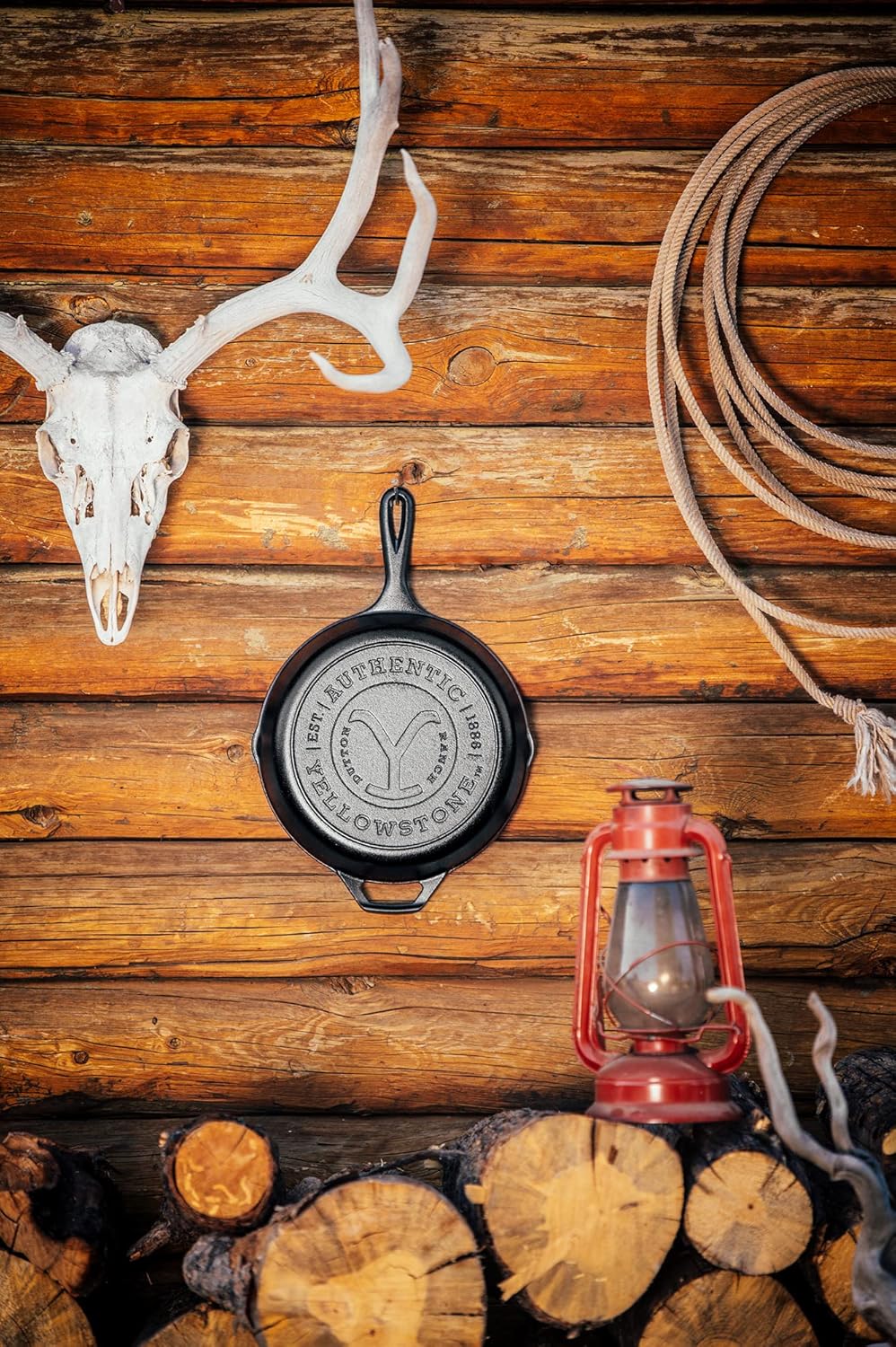 Lodge Pre-Seasoned Yellowstone Stamped Cast Iron Cookware - Signature Teardrop Handle - Use in the Oven, on the Stove, on the Grill, or Over a Campfire - 10.25 Inch Logo Skillet